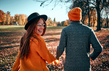 Couple in park in autumn