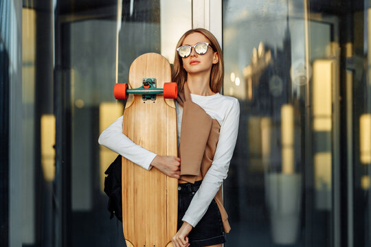 Female casual style. Woman with a skete.