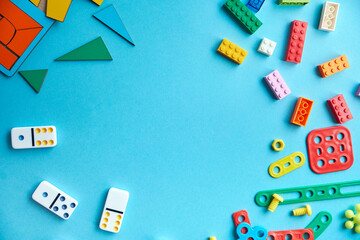 Educational Logic Games. Preschool Learning Toys. School supplies, stationery on blue background space for caption. Back to school concept. Top view colorful background. Flat lay