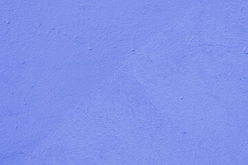 Blue wall of the building. Rough plaster surface. Abstract background.