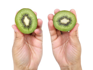 Hand holds sliced half of kiwi fruit and whole kiwi fruit isolated on white background