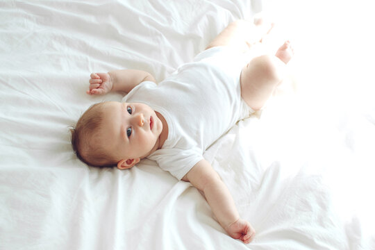 Infant child. The child lies on a blanket.High quality photo.
