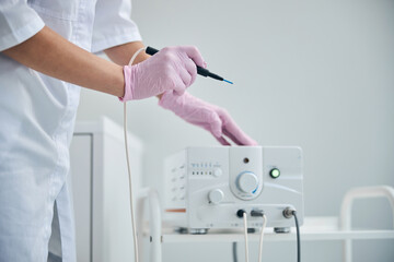 Doctor getting ready for an electrosurgical procedure