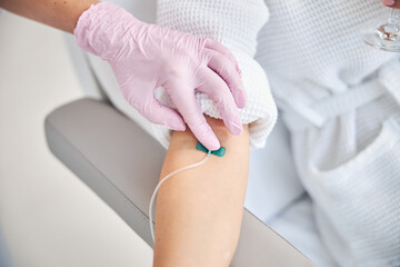 Woman undergoing a medical procedure in a beauty clinic