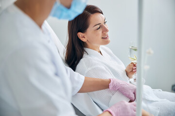 Patient smiling during the intravenous vitamin therapy