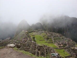 inca ruins of machu picchu in the mist