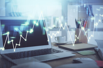 Forex Chart hologram on table with computer background. Double exposure. Concept of financial markets.