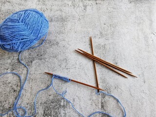 Knitting socks of wool yarn. Casting on stitches for knitting socks.