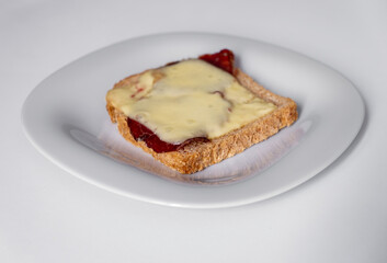 bacon and cheese toast on white plate