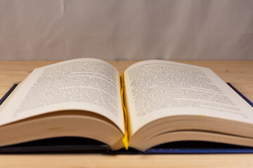 Open book on a natural wooden background