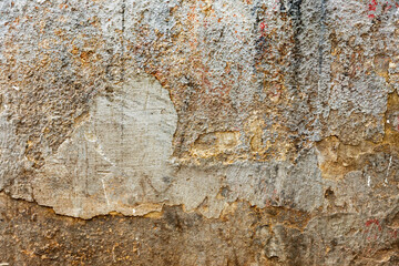 Background texture wall with peeling old paint. Old wooden background with remains of pieces of scraps of old paint on wood. Texture of an old tree, board with paint, vintage background peeling paint