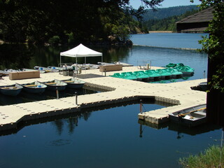 Peaceful lake mountains island trees dock boats