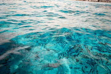 Fototapeta na wymiar Clear Water texture. Sea water ripple and waves in mediterranean sea. Transparent water texture