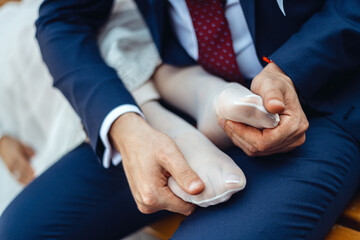 senior man holding his hand