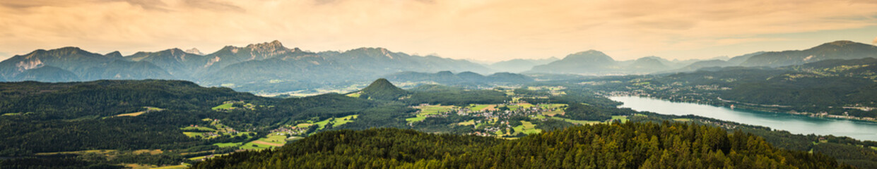 Fototapeta na wymiar Panorama of Alpine mountains near Lake Worthersee and Velden city