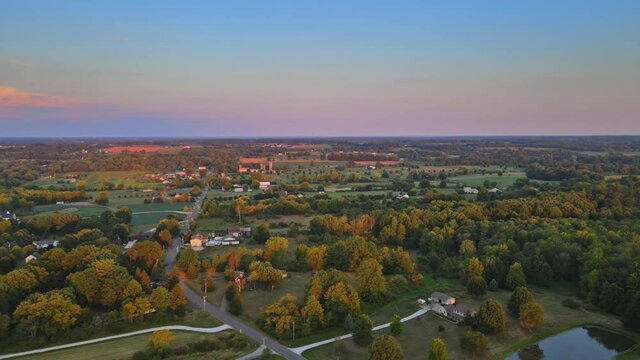 Panoramic view of farm fields from a height of agricultural landscape beautiful orange sunset light in Akron Ohio
