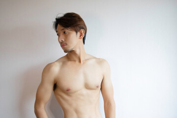 haft body Asian man stand without cloths.