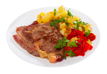 Fototapeta premium Homemade veal steak with fried potato and marinated red pepper. Isolated over white background