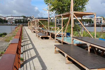picnic tables along the river loire in nantes (france)