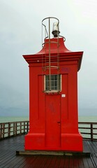 red lighthouse on the coast