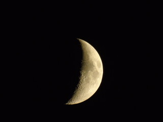 waxing crescent moon in black sky