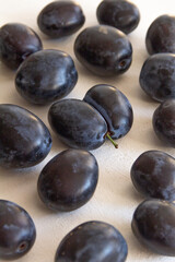 fresh dark blue plum on white background