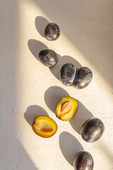 fresh dark blue plum on white background