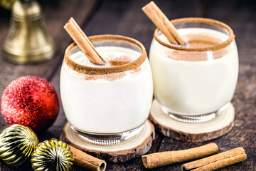 Eggnog with cinnamon and nutmeg for Christmas and winter holidays. Homemade eggnog consumed around the world on Christmas holidays