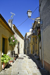 A small road crosses the old buildings of Calvello, a old Town in the Basilicata region, Italy.
