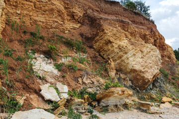 Landslide zone on Black Sea coast. Rock of sea rock shell. Zone of natural disasters during rainy season. Large masses of earth slip along slope of hill, destroy houses. Landslide - threat to life