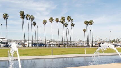 Obraz premium Fountain in waterfront city park near San Diego county civic center in downtown, California government authority, USA. Pacific ocean harbour, embarcadero in Gaslamp Quarter. Palms and grass near pier