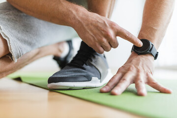 Handsome man working out at home