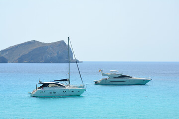 Fototapeta na wymiar Boats on the Balearic sea by Ibiza island, Spain.