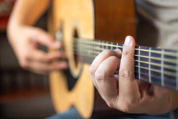 man playing acoustic guitar