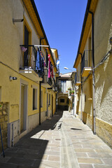 A small road crosses the old buildings of Calvello, a old Town in the Basilicata region, Italy.