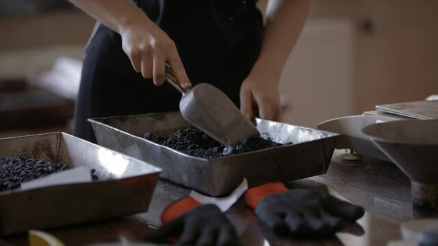 Slow-mo: Female Laboratory Technician Mixes Small Bitumen Samples