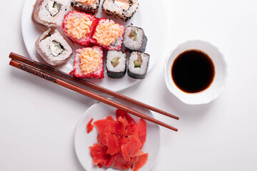 asian rice rolls on the white plate. white background.
