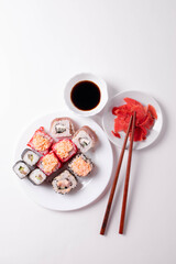 asian rice rolls on the white plate. white background.