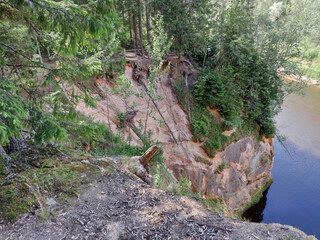 Obraz premium Sandstone cliffs. Erglu Cliffs (Ērgļu klintis), on the bank of the Gauja river. Gauja National park