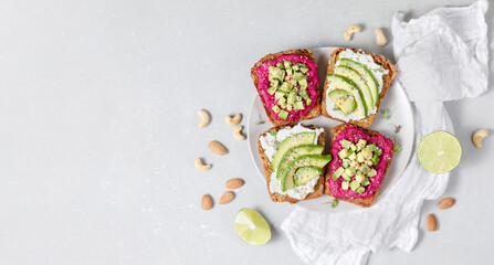 Variation of rye bread sandwiches with avocado beetroot and cream cheese