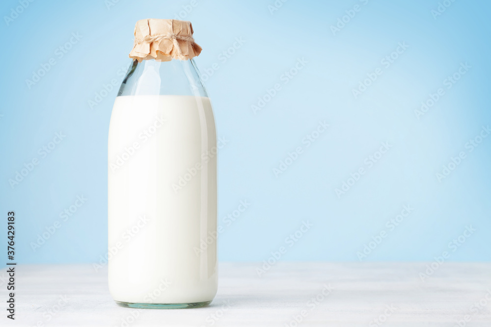 Wall mural milk in glass bottle