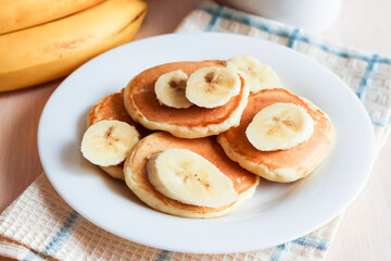 pancakes with banana on plate