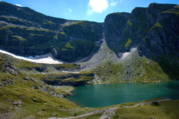 Naklejka na ściany i meble Kleiner alpiner See auf dem Pizol in der Schweiz 7.8.2020