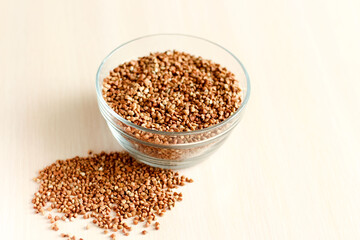 Raw buckwheat in glass bowl