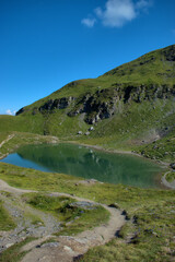 Fototapeta na wymiar Kleiner alpiner See auf dem Pizol in der Schweiz 7.8.2020