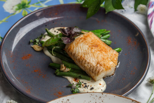 Baked Wild Alaskan Salmon Served With Green Beans On Grey Plate On The Table