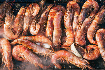 Prawns on a barbecue grill.
