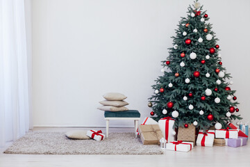 Blue Christmas tree with gifts decor for the new year winter in the white room
