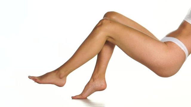 nicely groomed female legs on a white background
