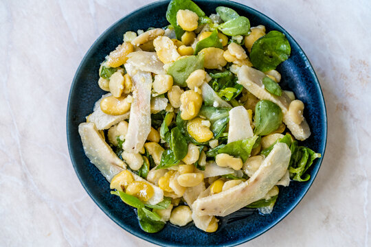 Sliced Artichoke with Broad Beans, Purslane Salad, Grated Parmesan Cheese and Olive Oil.